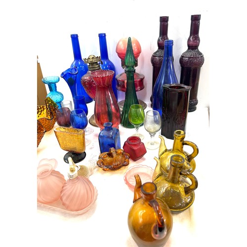 239 - Large selection of coloured glass includes decanters etc