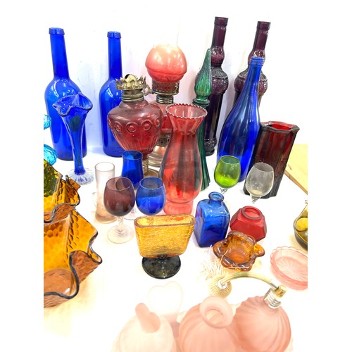 239 - Large selection of coloured glass includes decanters etc