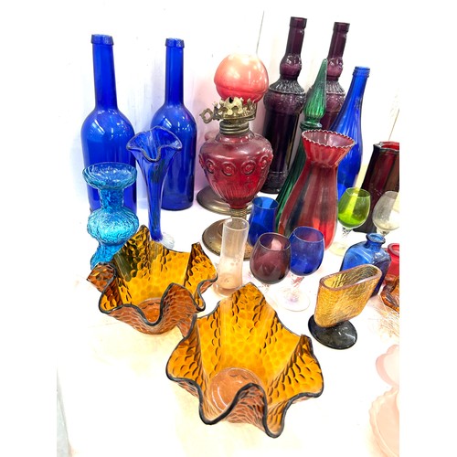 239 - Large selection of coloured glass includes decanters etc