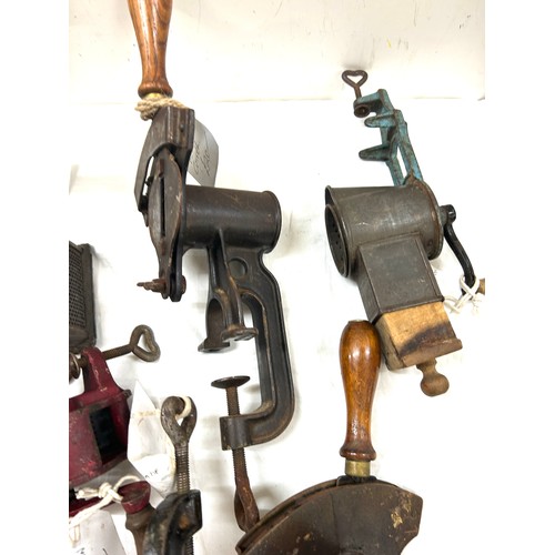 194 - Selection vintage tools to include a fruit press, knife sharpener, Potato ricer, meat grinder etc