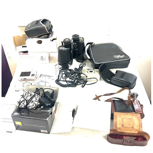 155 - Selection of cameras and binoculars to include Tasco binoculars, Canon sure shot, etc all untested