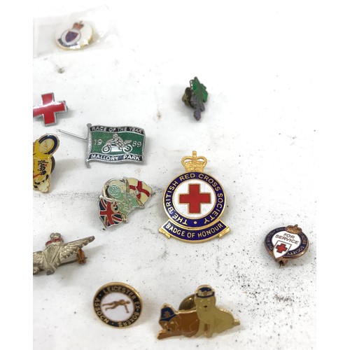 469 - Selection of enamel badges and pins to include British red cross etc