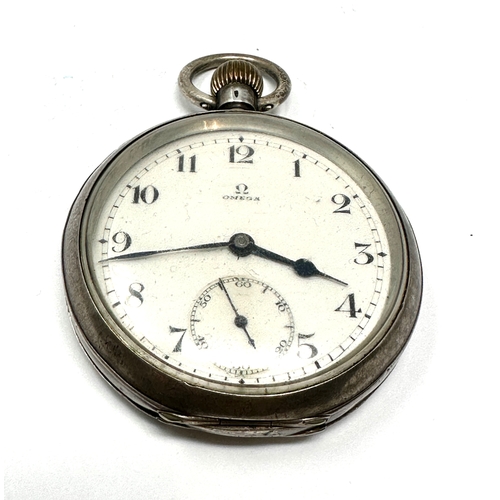 396 - Antique silver open face Omega pocket watch the watch balance spins the watch keep winding