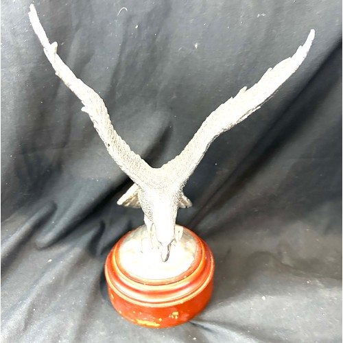 516 - Silver plated eagle mounted on a wooden base height 9 inches tall