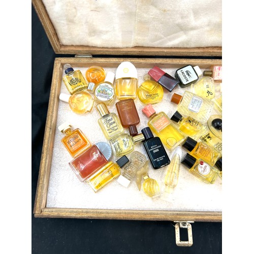 212 - Cased set of miniature perfumes