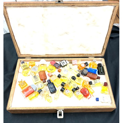 212 - Cased set of miniature perfumes