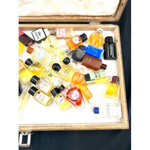 212 - Cased set of miniature perfumes