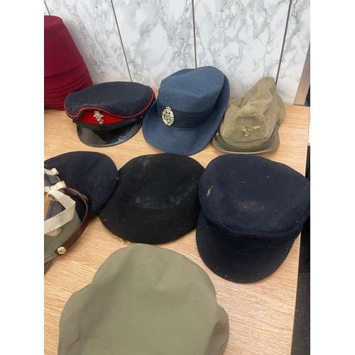 215 - Large selection of vintage and later hats and helmets