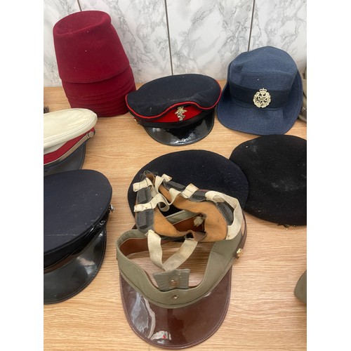 215 - Large selection of vintage and later hats and helmets