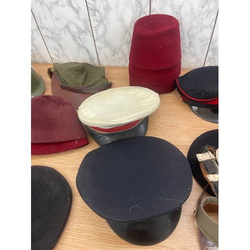 215 - Large selection of vintage and later hats and helmets