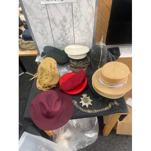 215 - Large selection of vintage and later hats and helmets