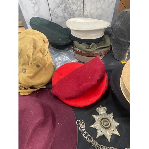 215 - Large selection of vintage and later hats and helmets