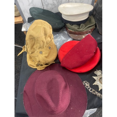 215 - Large selection of vintage and later hats and helmets