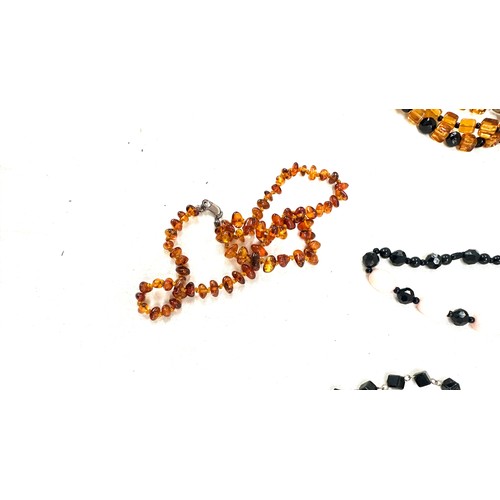 454 - Selection of vintage bead necklaces to include amber