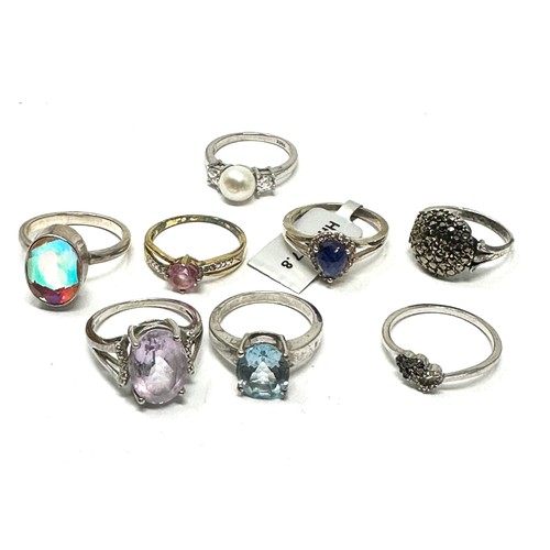 296 - Eight silver stone set rings i(24g)