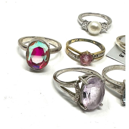 296 - Eight silver stone set rings i(24g)