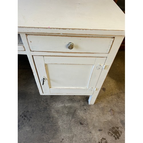 403 - 4 Drawer painted desk measures approximately 30 inches 60 inches wide by 24 inches