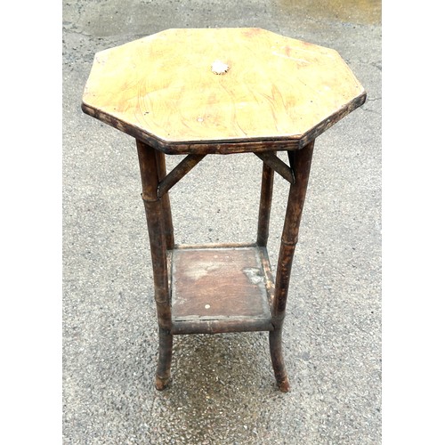 387 - Small bamboo Octagonal plant stand measures approximately 28 inches tall 17 inches