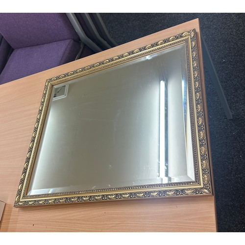 124 - Vintage gilt framed mirror measures approx 26.5 inches tall by 23 wide