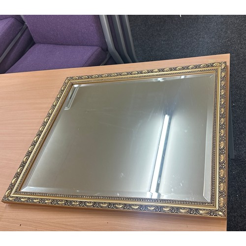 124 - Vintage gilt framed mirror measures approx 26.5 inches tall by 23 wide