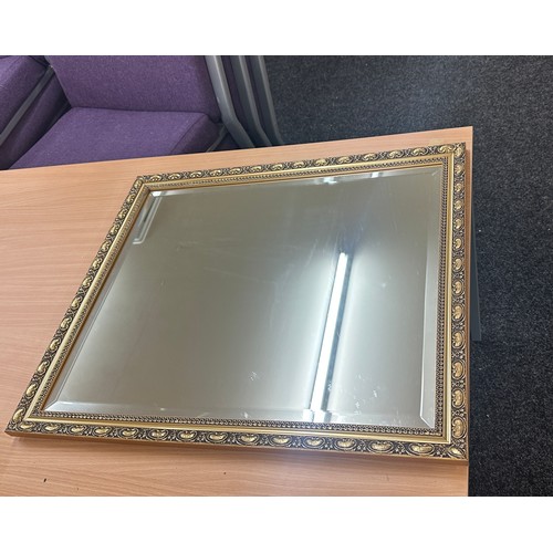 124 - Vintage gilt framed mirror measures approx 26.5 inches tall by 23 wide