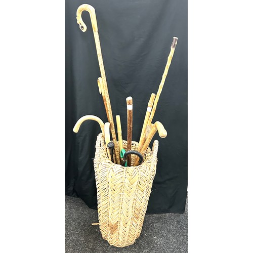 234 - Selection of walking sticks and a walking stick stand