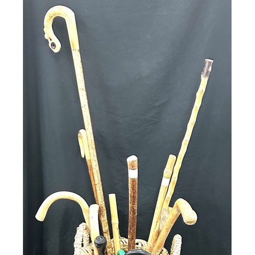 234 - Selection of walking sticks and a walking stick stand