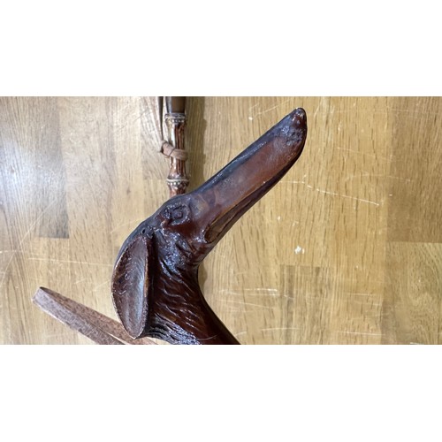 105 - 2 Carved cane shoe horns