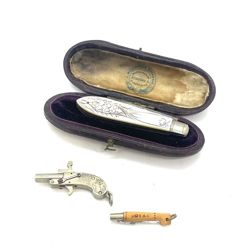 591 - Silver cased pocket knife complete with antique miniature gun