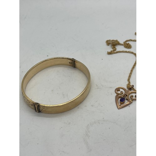 582 - 9ct gold art nouveau pendant set with amethyst and 9ct gold metal core bangle