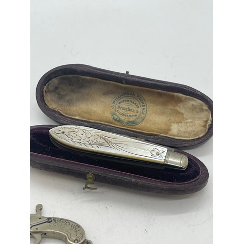 591 - Silver cased pocket knife complete with antique miniature gun