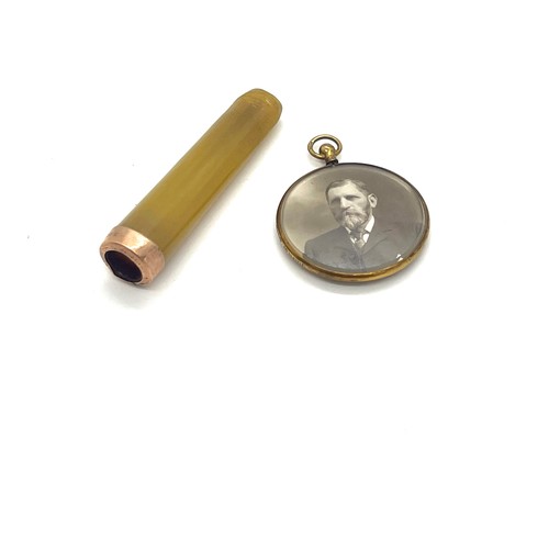 590 - Antique 9ct gold locket and a cheroot holder with 9ct gold mount