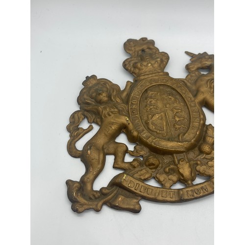 526 - Ministry of Defence police helmet plate together with victorian Royal Cipher plaque