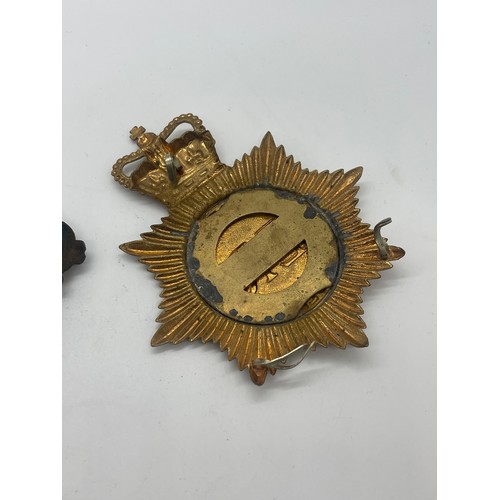 526 - Ministry of Defence police helmet plate together with victorian Royal Cipher plaque