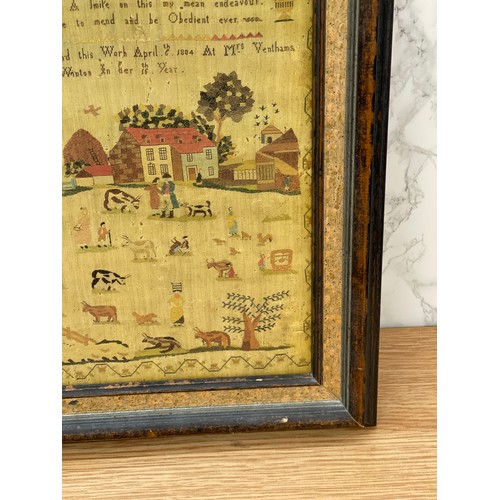 278 - Print of an antique needlework sampler frame size 28 x 37 cm.