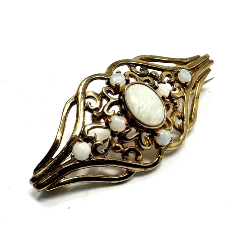 80 - 9ct gold opal brooch measures approx 4cm by 1.7cm weight 4g