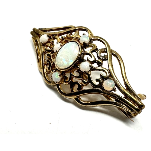 80 - 9ct gold opal brooch measures approx 4cm by 1.7cm weight 4g