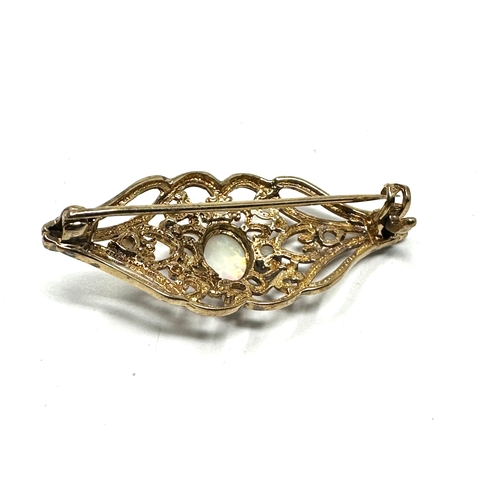 80 - 9ct gold opal brooch measures approx 4cm by 1.7cm weight 4g