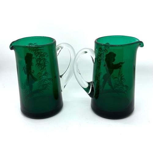 555 - Pair of Victorian Mary Gregory green glass jugs, very good overall condition