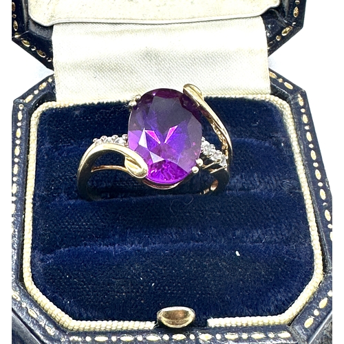 99 - 10ct gold Amethyst & white gemstone ring weight 4.8 g