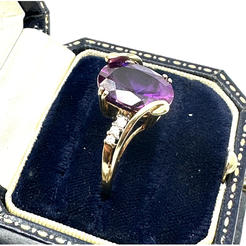 99 - 10ct gold Amethyst & white gemstone ring weight 4.8 g