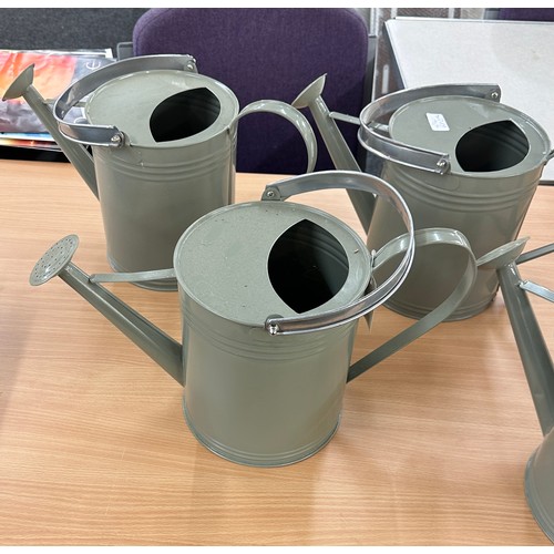 256 - 4 grey watering cans