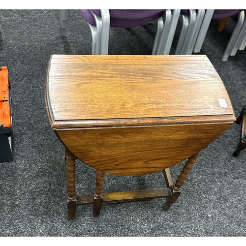 316 - Oak drop leaf table with barley twists legs measures approx leaf down 30 inches tall, 23 wide and 12... 