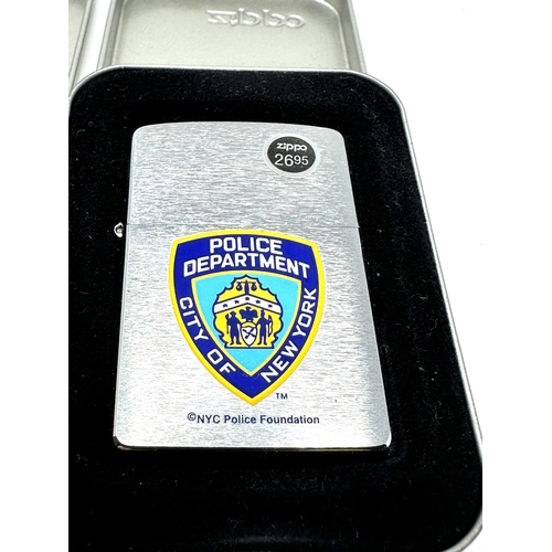 423 - 2 original boxed vintage zippo lighters inc new york police department & Elvis