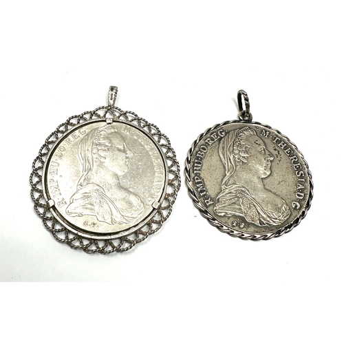 428 - 2 pendant framed M.Theresiad silver coins