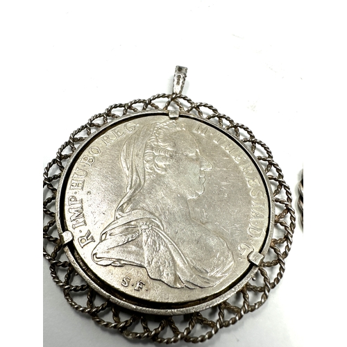 428 - 2 pendant framed M.Theresiad silver coins