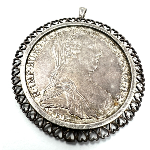 429 - 2 pendant framed M.Theresiad silver coins