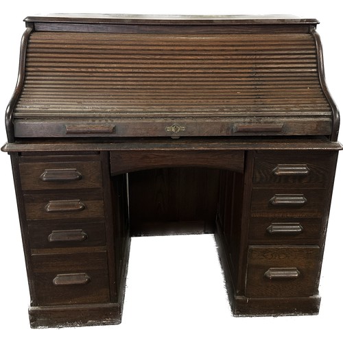 310 - Antique oak twin pedastool roll top desk measures approximately 47 inches tall 48 inches wide 27.5 i... 