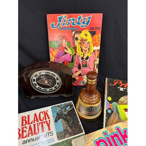 215 - Selection of vintage Jackie annuals, Vintage Smiths mantel clock, small Wade Bells whisky (empty) vi... 