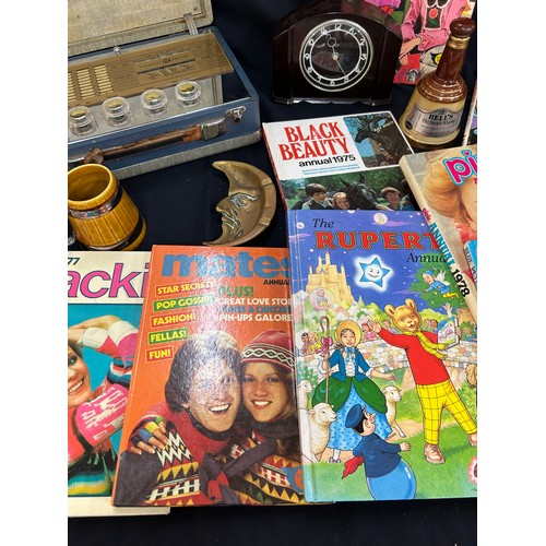 215 - Selection of vintage Jackie annuals, Vintage Smiths mantel clock, small Wade Bells whisky (empty) vi... 